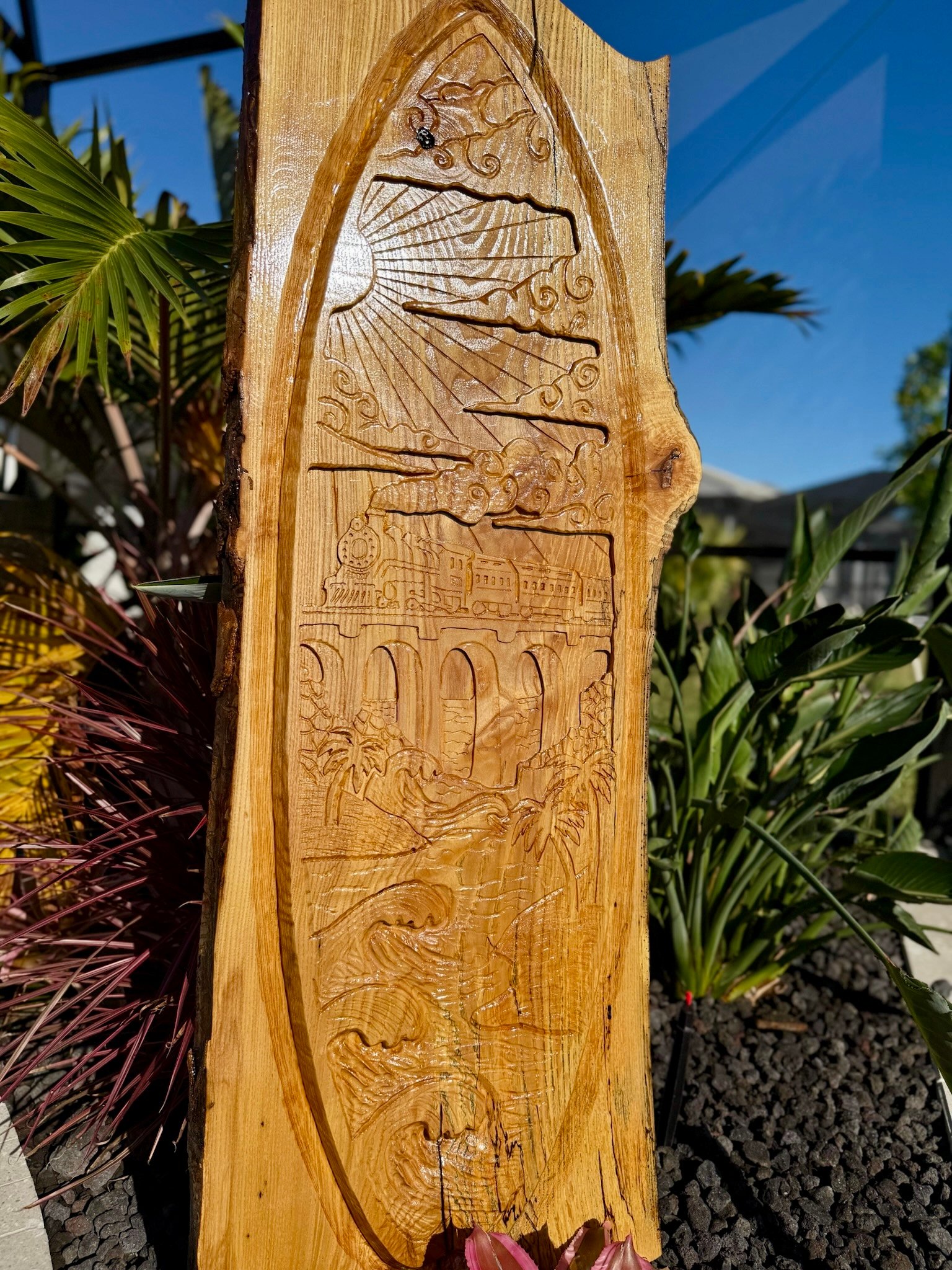 Train to Paradise hand-carved live-edge wood sculpture depicting Henry Flagler's railroad crossing the Florida Keys